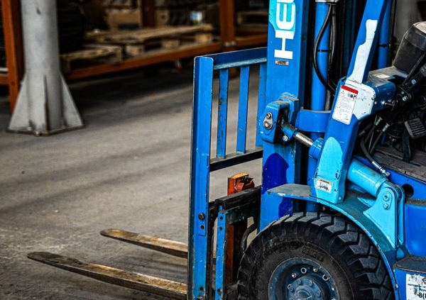 Forklift equipment in an industrial yard, representing new equipment purchases
